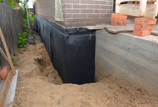 SJ Waterproofing Pros technician performing targeted Wet Basement Repair assessment in Greeneville, TN